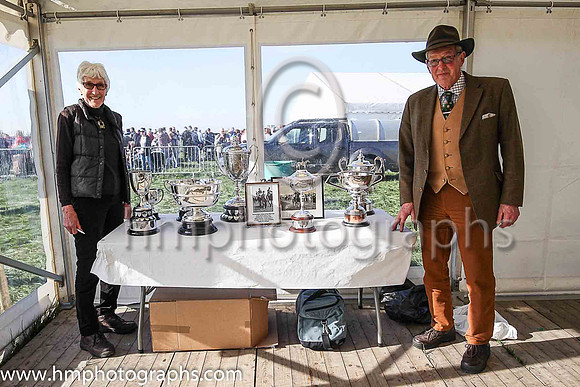 Hope Gardiner , Announcer and John Stewart Clerk of the Scales with the trophys at The Route Point to Pont at Portrush
