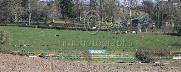 Spectators watch the racing in the sunshine at Downpatrick on Sunday