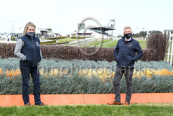 Richard Lyttle Racecourse Manager at Downpatrick Racecourse  and Katesbridge trainer Sarah Dawson at the last fence on 3rd May 2021