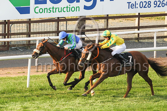 New Sodiety and Sorcha Woods (1, royal blue, emerald green chevron ) in the lead to win the Molson Coors Beverage Company Apprentice Handicap at Down Royal on Friday 23rd July 2021