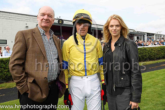 John Taylor with jockey Keith Donoghue and his daughter Sarah at Downpatrick Races. Sarah is taking a holiday at home from her job as a model with IMG in New York.John's horse Blue Empyrean trained by