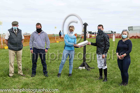 Lesley Jones, Master of the North Down Hunt Club presenting a gift to Barry O'Neill to recognise his success in becoming the leading point to point rider in Ireland in the current season. <br/>He also