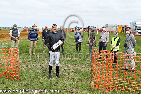 Barry O'Neill with member of the North Down Hunt Club who presented him with a gift to recognise his success in becoming the leading point to point rider in Ireland in the current season. <br/>He also