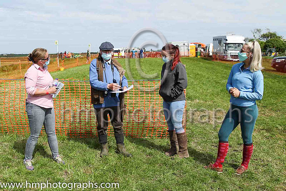 Turf Club official Frankie Fitzsimmons in discussion with fence stewards Kim Dunn, Bailey Dunn and Rebecca Keery at North Down Hunt Club Point to Point Steeplechases at Kirkistown