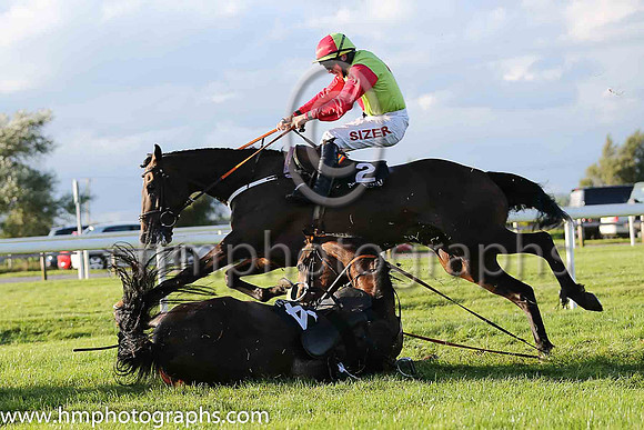 Fell - Redrobin and David Mulline (14, pink and grey diamonds) trainer David Harry Kelly - horse and rider were ok