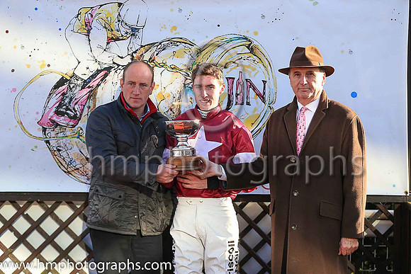 James Nicholson presenting the trophy to Jack Kennedy jockey and Ian Almond representing the Owners Gigginstown House Stud after Outlander won the JNWINE.COM Champion Chase at Down Royal.