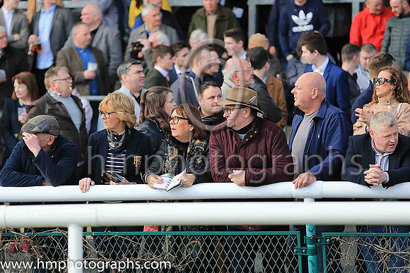 Watching for the horses at Downpatrick Races
