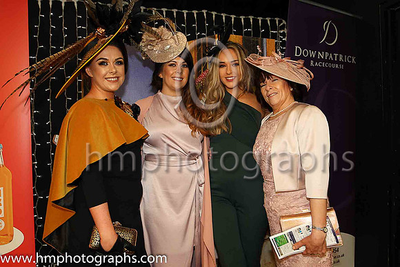 Sisters Clare Murnin (finalist in the WKD Most appropiately dressed lady competion), Laura Brennan, Michael McAvoy with their mum Winnie McAvoy from Newcastle at Downpatrick Races