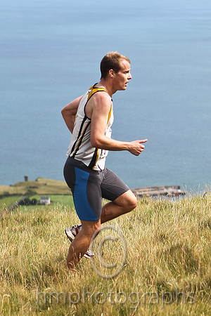 Joe McAlister of St Malachy's on the summit of Lurig, 1st in 28.50 - FT8E3255-e