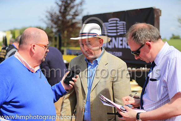 Jim Bolger's representative being interviewed by the press after Change of Velocity wins the Magners Ulster Derby at Down Royal