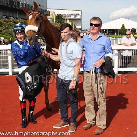 01st Manzil and D P McDonogh ( 4 , royal blue, white epaulettes ) Trainer - D K Weld , Owner - Hamdan Al Maktoum