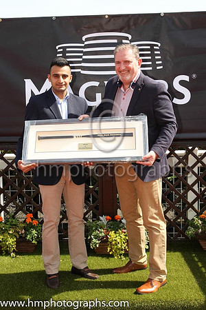 Hussain Ali of Godolphin and Terry McCourt of Magners in the parade ring at Down Royal after Change of Velocity wins the Magners Ulster Derby