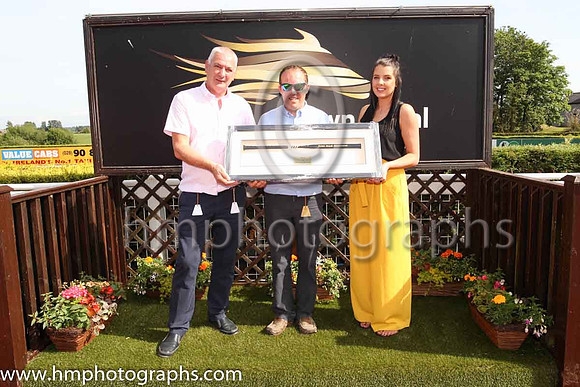 Brendan Flynn, Mark NcNiff and Caroline Todd in the parade ring after Last Garrison and D P McDonogh win the The Down Royal Handicap at the Magners Ulster Derby Day at Down Royal