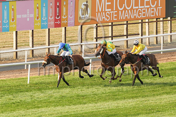 New Sodiety and Sorcha Woods (1, royal blue, emerald green chevron ) in the lead to win the Molson Coors Beverage Company Apprentice Handicap at Down Royal on Friday 23rd July 2021