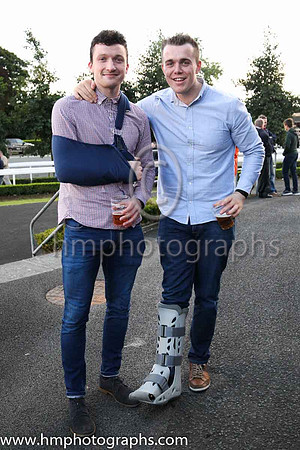 On the sidelines - Dermot McAleese (broken collar bone) and Niall Kelly (Fractured foot) from Portglenone enjoying the racing at Down Royal