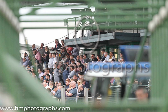 Spectators at Down Royal viewed through the Starting Stalls