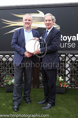 Joe Osborne, representing owners Godolphin receiving the trophy from David Lindsay , Lord Lieutenant of Down after Twilight Payment and jockey Kevin Manning won Her Majesty's Plate Stakes (Listed Race