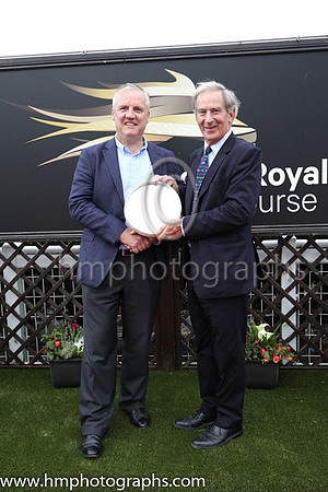 Joe Osborne, representing owners Godolphin receiving the trophy from David Lindsay , Lord Lieutenant of Down after Twilight Payment and jockey Kevin Manning won Her Majesty's Plate Stakes (Listed Race