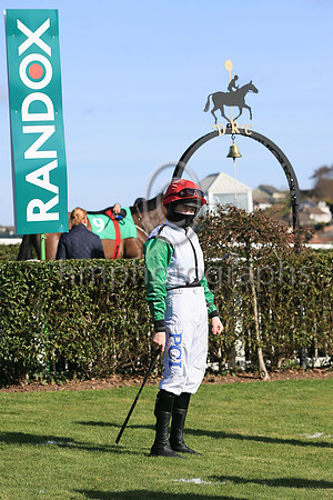 Rachael Blackmore in the parade ring at DOwnpatrick Racecourse waiting for her trainer
