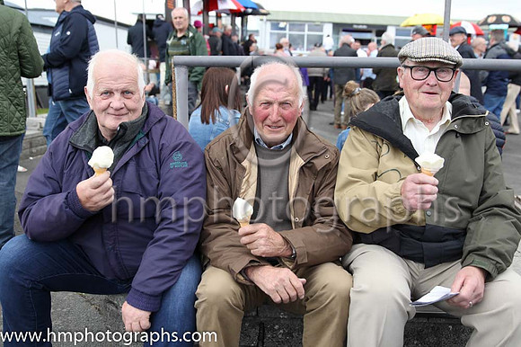 Ned Carlisle from Ballynahinch, Sam Hanna from Ballygowan and Wilbert George from Saintfield enjoying an Ice Cream at Downpatrick Races on 12th June 2022