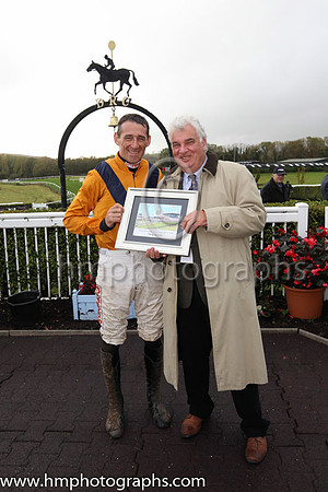Chairman of the Board of Directors of Downpatrick Racecourse Peter Stewart (right) making a presentation to the winning jockey for 2018, Davy Russell
