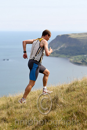 Joe McAlister of St Malachy's on the summit of Lurig, 1st in 28.50 - FT8E3258-e