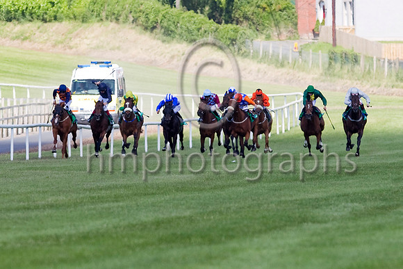 Celtic Dane (Orange Cap),  Jockey C D Haynes 4th from right wins the Specsavers 2 For 1 Ulster Derby beating Northgate (Grey red star), Jockey P J Smullen, extreme right - FT8E1317-e3a4j