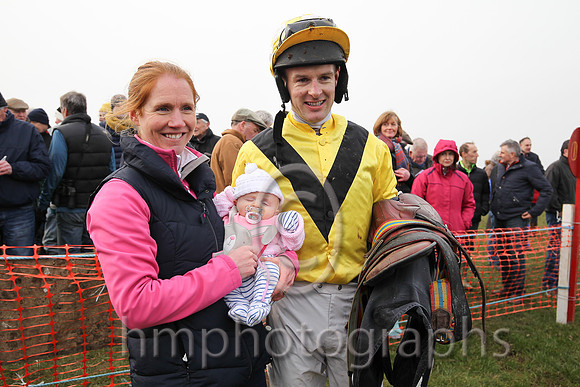 Mark O'Hare wife Sarah and 7 week old baby girl Penny in the parade ring after Mark's win on Sixteen Again at Tynan and Armagh Point to Point Races
