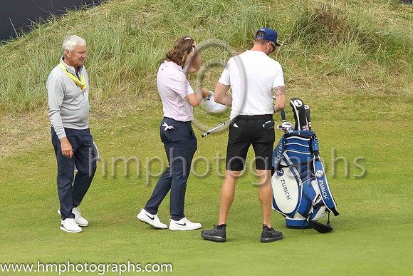 Tommy Fleetwood fixes his hair on the 18th green on the second day of practice at the 2019 Open at Royal Portrush