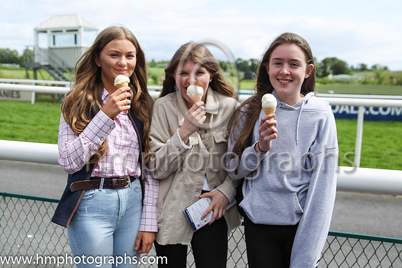 Racheal Thompson, Julie Thompson and Katie Morrow enjoying an ice cream at Downpatrick Races on 12th June 2022