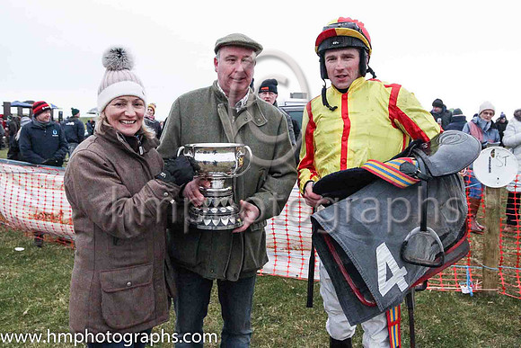 Stephen and Yvonne Pearson from Newtownards owners of Double Smart with jockey Declan Lavery in the parade ring after Double Smart won the memorial race sponsored by William McDowell and Stephen Magee