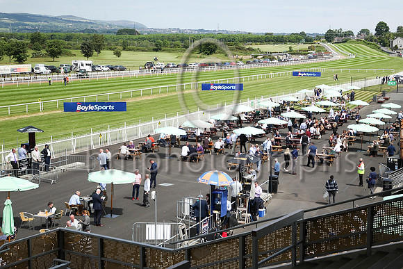 Spectators enjoying the sunshine at Down Royal on the Boylesports Ulster Derby Day