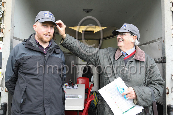 IHRB official Frankie Fitzsimmons adjusting Alan Mahon's new IHRB cap at the East Down Hunt P2P at Loughanmore on 23rd October 2021