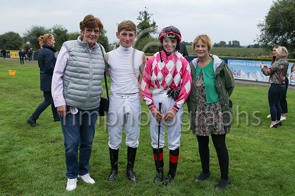Pauline Conlon and Mairead Price from Dublin representing the owners of Magi Gal with jockesy Cillian McConnell and Kyanna Jan Buuran in the parade ring before the Grant Thornton Handicap at Down Roya