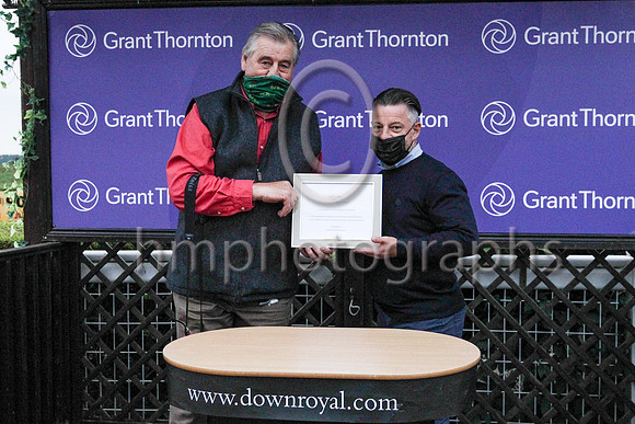 David Johnston (right), Chief Executive of Cambridge Education Group presenting to trainer Noel Meade at Down Royal on 3rd September 2021 after his horse Ben Siegel won the Johnston H andicap