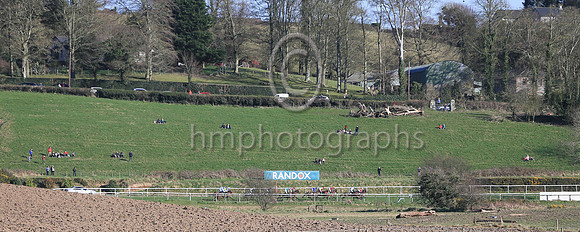Spectators watch the racing in the sunshine at Downpatrick on Sunday