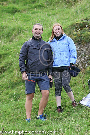 Spectators Niall Williamson and Simone Reynolds from Larne watching the Antrim Coast Half Marathon at Ballygally Head. Niall and Simone had cycled from Larne to watch the race as the runners rounded B