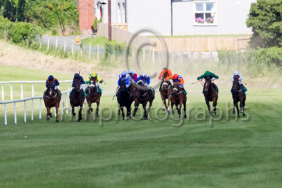 Celtic Dane (Orange Cap),  Jockey C D Haynes 3rd from right wins the Specsavers 2 For 1 Ulster Derby beating Northgate (Grey red star), Jockey P J Smullen, extreme right - FT8E1311-e3a4j