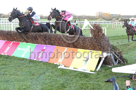 Simon Torrens on the ground - bottom right - after Benefit Run ran out at the fence.