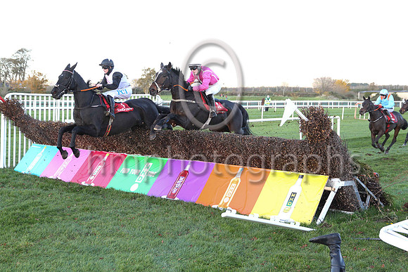 Simon Torrens on the ground - bottom right - after Benefit Run ran out at the fence.