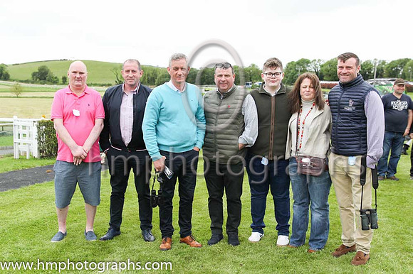 Local trainer Brian Hamilton (third from left) with Paul Burns (extreme right) and his party in the parade ring at Downpatrick Races on 12th June 2022 before Race 6 - The Dunlop Homes Handicap Hurdle.