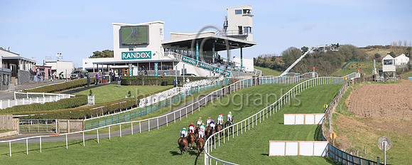 No spectators at the Ulster National Steeplechase Meeting at Downpatrick as horses race up the hill on Sunday