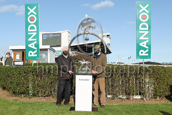 Peter Stewart, the chairman of the Downpatrick Racecourse with Arthur Moore trainer of Fag an Bealach winner of the R andox Ulster National Steeplechase at Downpatrick on Sunday