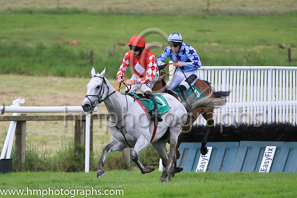 Race 1 winner - Roaring Potter ridden by Shane Fitzgerald in red colours with white diamond, number 1