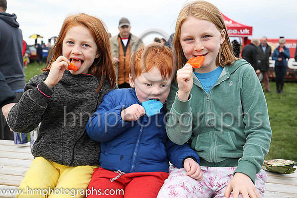 Maddy, Frankie and Gracie McNally enjoy their lollypops at The Route Point-To-Point Steeplechases at Portrush