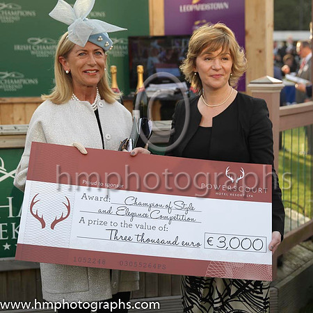 Liz Maher form Bagnellstown Co Carlow receives one of her prizes for winning the style and Elegance Competition at the Irish Champions Weekend at Leopardstown - a 5 star stay at the Powerscourt Hotel