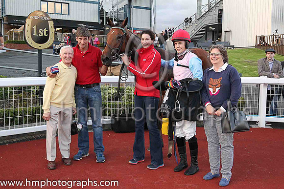 01st Joy's Gift and Mr F Maguire (4, pink, light blue sleeves) , trainer Peter Maher (red top) and Caroline Woods with horse