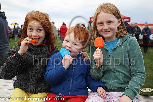 Maddy, Frankie and Gracie McNally enjoy their lollypops at The Route Point-To-Point Steeplechases at Portrush