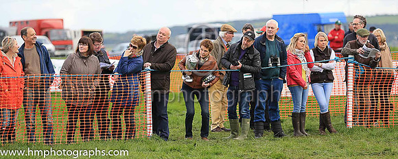 Spectators at the Route P2P Steeplechases showing various degrees of interest in the racing
