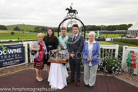 Family and friends of the late Dr E F Logan OBE and winning jockey Donagh Meyler in aht eparade ring at Downpatrick Racecourse after Dr E F Logan OBE Memorial Handicap Steeplechase.